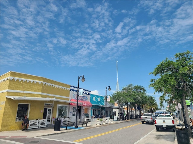 3849 Sailmaker Ln Unit 0, Holiday, FL 34691 - view of asphalt street featuring street lights, sidewalks, and curbs