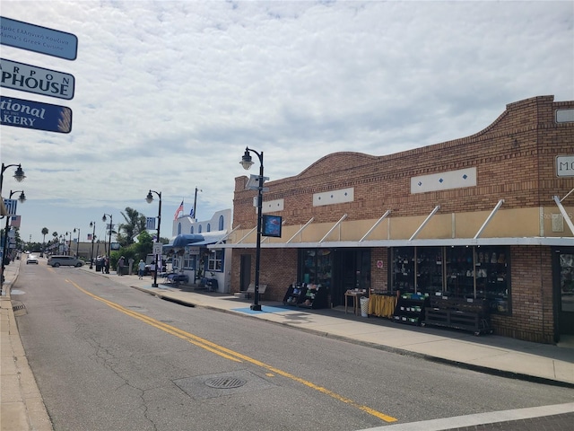 3849 Sailmaker Ln Unit 0, Holiday, FL 34691 - view of asphalt street featuring sidewalks, curbs, and street lights
