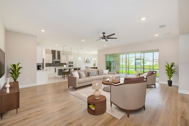 8717 Sanders Tree Loop, Wesley Chapel, FL 33545 - living room featuring ceiling fan, light wood-style floors, and recessed lighting