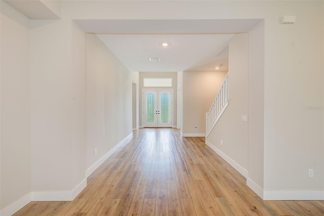 8717 Sanders Tree Loop, Wesley Chapel, FL 33545 - entryway with light wood-style flooring, stairway, and recessed lighting