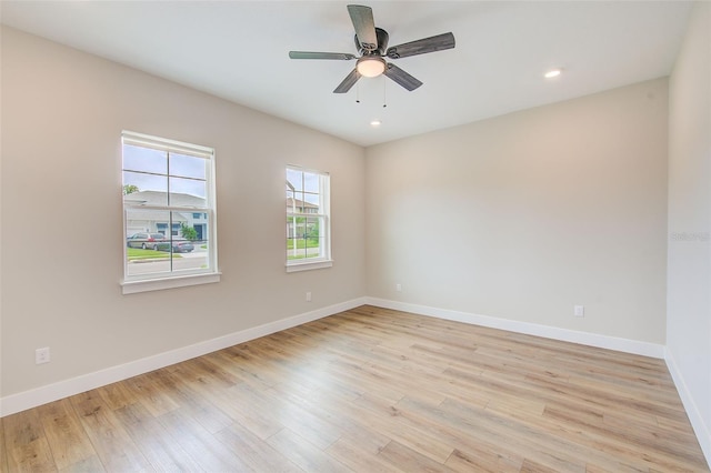 8717 Sanders Tree Loop, Wesley Chapel, FL 33545 - spare room with light wood-type flooring, a ceiling fan, and recessed lighting