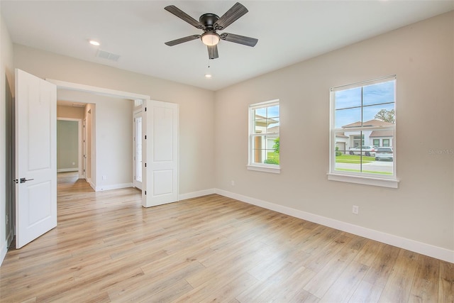 8717 Sanders Tree Loop, Wesley Chapel, FL 33545 - spare room featuring light wood-style floors, a ceiling fan, and recessed lighting