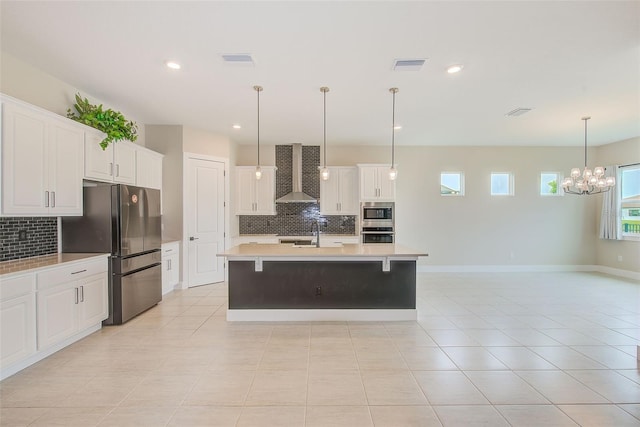 8717 Sanders Tree Loop, Wesley Chapel, FL 33545 - kitchen with appliances with stainless steel finishes, wall chimney exhaust hood, tasteful backsplash, light countertops, and recessed lighting