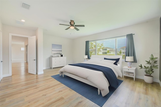 8717 Sanders Tree Loop, Wesley Chapel, FL 33545 - bedroom with light wood-style floors, ceiling fan, and recessed lighting