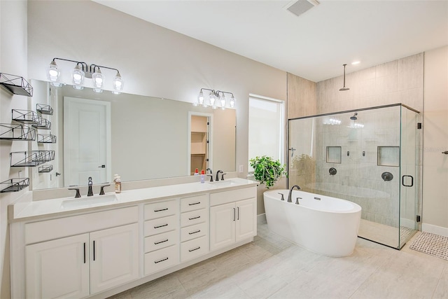 8717 Sanders Tree Loop, Wesley Chapel, FL 33545 - full bathroom with a stall shower, double vanity, and a soaking tub