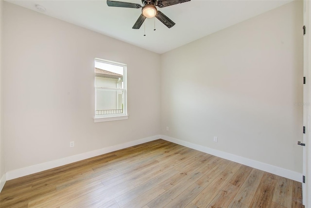8717 Sanders Tree Loop, Wesley Chapel, FL 33545 - empty room with light wood finished floors, a ceiling fan, and a smoke detector