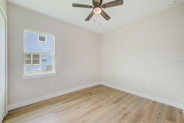 8717 Sanders Tree Loop, Wesley Chapel, FL 33545 - spare room featuring wood finished floors, a smoke detector, and ceiling fan