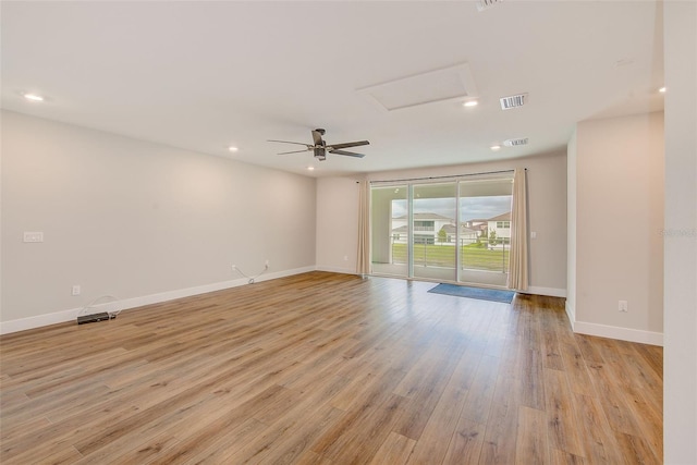 8717 Sanders Tree Loop, Wesley Chapel, FL 33545 - unfurnished room with light wood-style floors, attic access, recessed lighting, and a ceiling fan