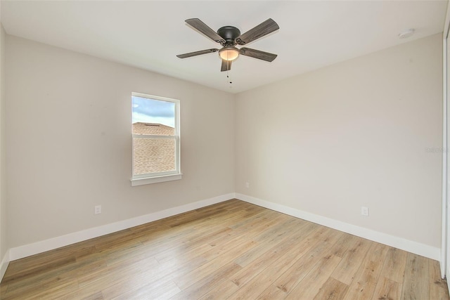 8717 Sanders Tree Loop, Wesley Chapel, FL 33545 - spare room with a smoke detector, light wood-type flooring, and a ceiling fan