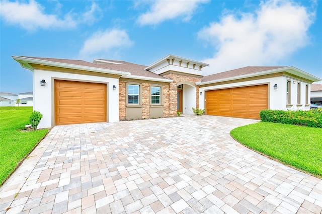 8717 Sanders Tree Loop, Wesley Chapel, FL 33545 - view of front facade with an attached garage, decorative driveway, a front lawn, stucco siding, and stone siding
