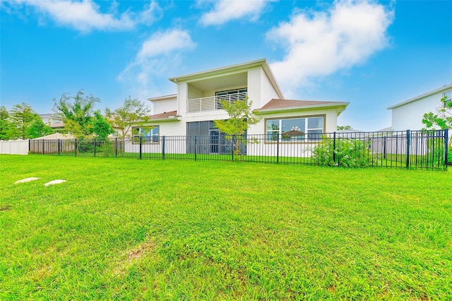 8717 Sanders Tree Loop, Wesley Chapel, FL 33545 - back of house with stucco siding and a balcony