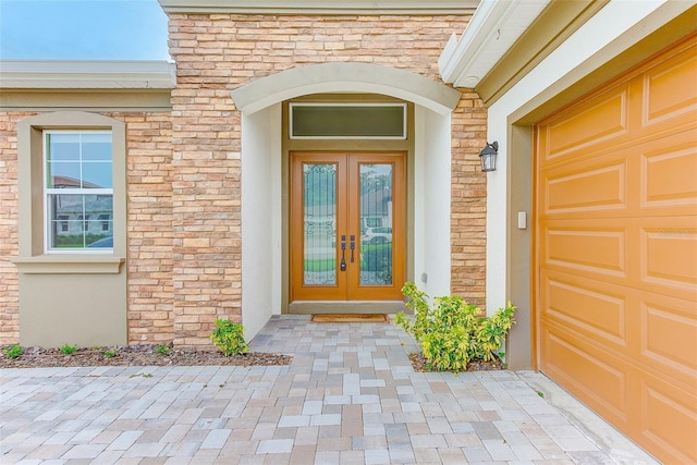 8717 Sanders Tree Loop, Wesley Chapel, FL 33545 - entrance to property featuring french doors and stone siding