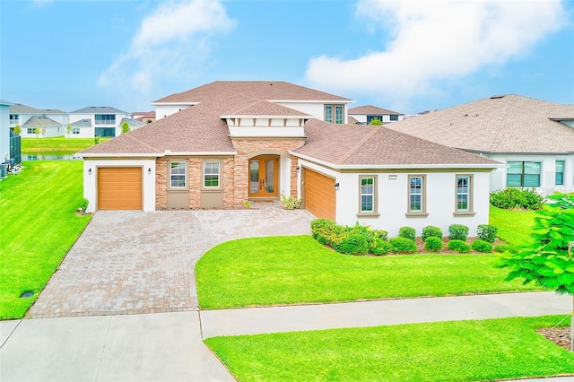 8717 Sanders Tree Loop, Wesley Chapel, FL 33545 - view of front of house featuring an attached garage, decorative driveway, a shingled roof, and a front yard