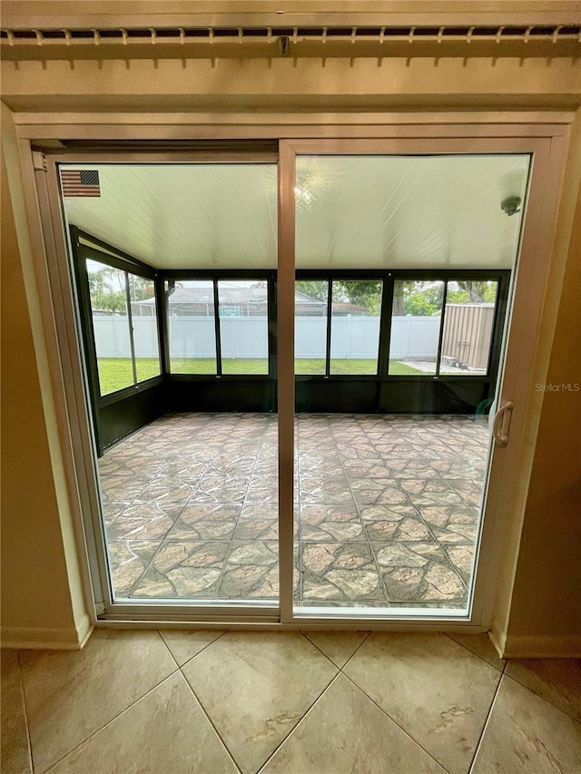 7026 20th St N, Saint Petersburg, FL 33702 - unfurnished sunroom with plenty of natural light and tile patterned flooring