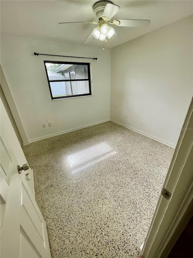 7026 20th St N, Saint Petersburg, FL 33702 - spare room with speckled floor and a ceiling fan