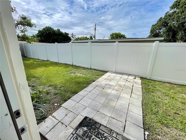 7026 20th St N, Saint Petersburg, FL 33702 - fenced backyard featuring a patio