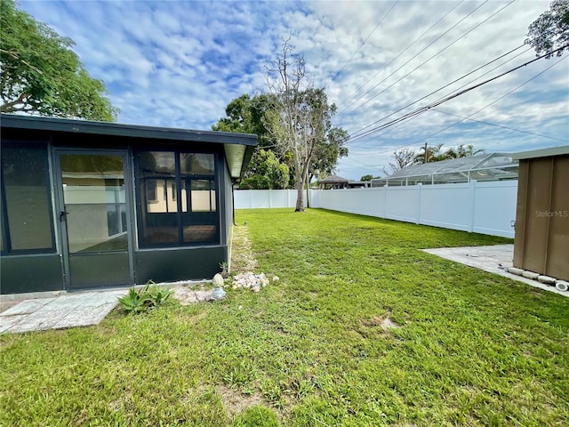7026 20th St N, Saint Petersburg, FL 33702 - fenced backyard with a sunroom