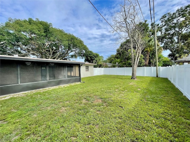 7026 20th St N, Saint Petersburg, FL 33702 - fenced backyard featuring a sunroom