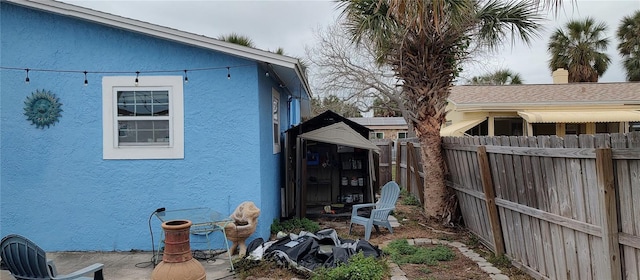 7623 Gulf Blvd, St Pete Beach, FL 33706 - view of side of home with stucco siding