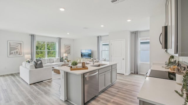 2615 Hardin Way, Zephyrhills, FL 33541 - kitchen featuring stainless steel appliances, open floor plan, light countertops, gray cabinetry, and recessed lighting