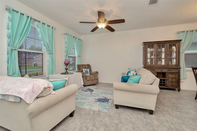 11240 Merganser Way, New Port Richey, FL 34654 - living room featuring a ceiling fan and light tile patterned floors