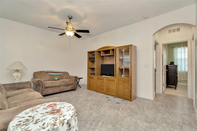 11240 Merganser Way, New Port Richey, FL 34654 - living area featuring arched walkways and ceiling fan