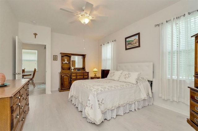 11240 Merganser Way, New Port Richey, FL 34654 - bedroom with light wood-style flooring and ceiling fan