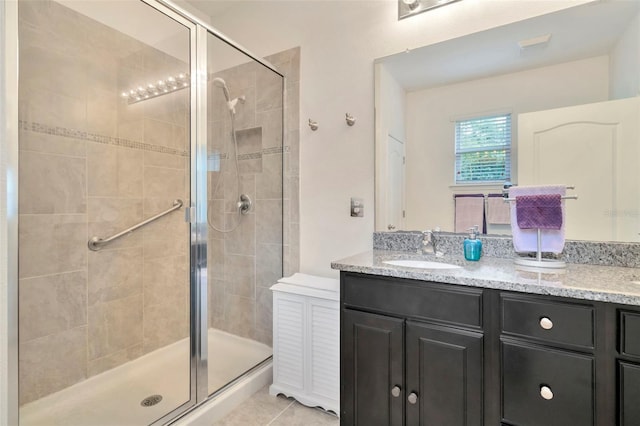 11240 Merganser Way, New Port Richey, FL 34654 - full bathroom featuring a shower stall, double vanity, and tile patterned floors