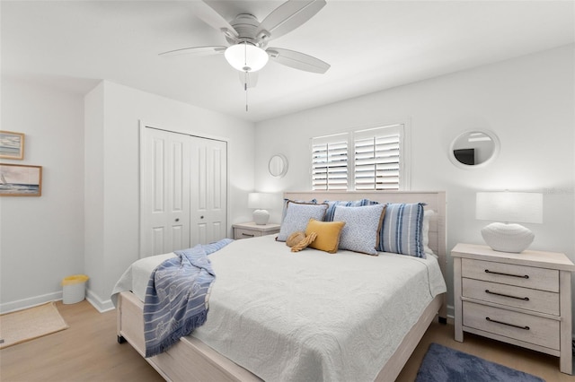 10280 Gulf Blvd Unit 12, Treasure Island, FL 33706 - bedroom with a closet, wood finished floors, and a ceiling fan