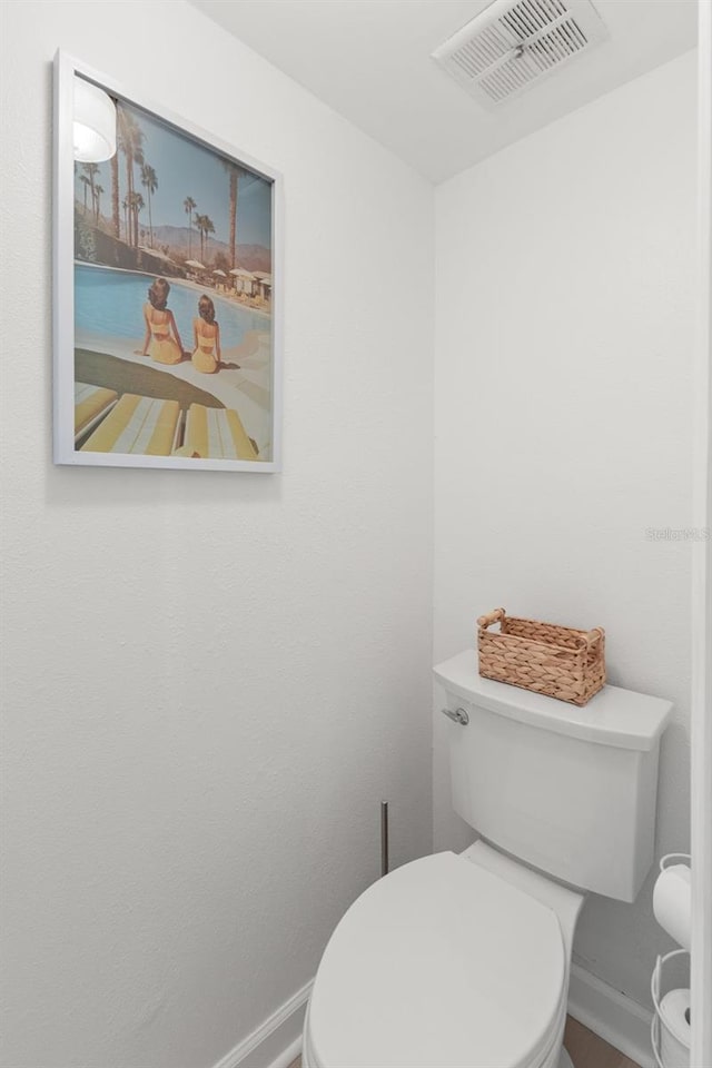 10280 Gulf Blvd Unit 12, Treasure Island, FL 33706 - bathroom featuring toilet and baseboards