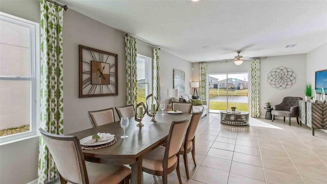 2593 Birney Run, Zephyrhills, FL 33541 - dining room featuring healthy amount of natural light, ceiling fan, and light tile patterned flooring
