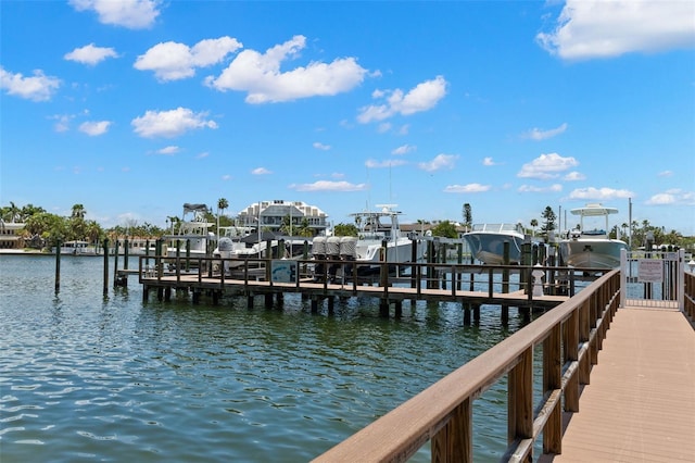 3805 Gulf Blvd Unit 401, St Pete Beach, FL 33706 - dock area featuring boat lift and a water view