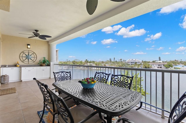 3805 Gulf Blvd Unit 401, St Pete Beach, FL 33706 - balcony featuring a ceiling fan, outdoor dining space, and a water view