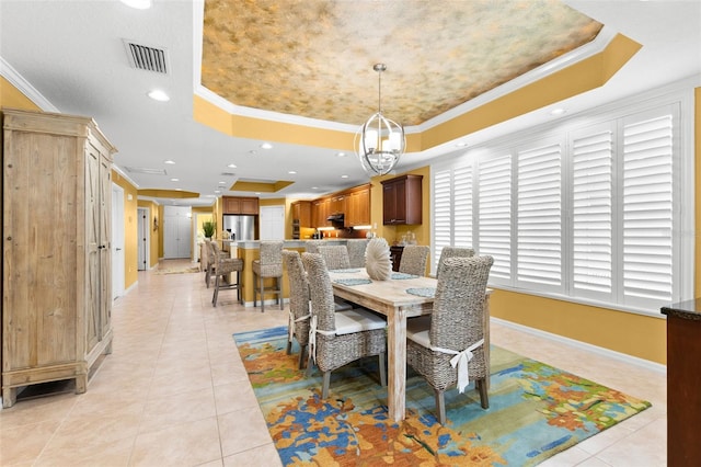3805 Gulf Blvd Unit 401, St Pete Beach, FL 33706 - dining room with a tray ceiling, crown molding, light tile patterned floors, and recessed lighting