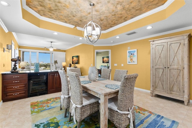 3805 Gulf Blvd Unit 401, St Pete Beach, FL 33706 - dining room featuring wine cooler, a raised ceiling, crown molding, recessed lighting, and light tile patterned flooring