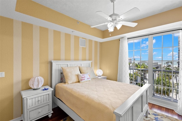 3805 Gulf Blvd Unit 401, St Pete Beach, FL 33706 - bedroom featuring dark wood finished floors and a ceiling fan