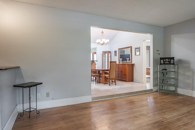 2421 Eagle Chase Dr, Palm Harbor, FL 34683 - dining space with hardwood / wood-style flooring, a chandelier, and lofted ceiling