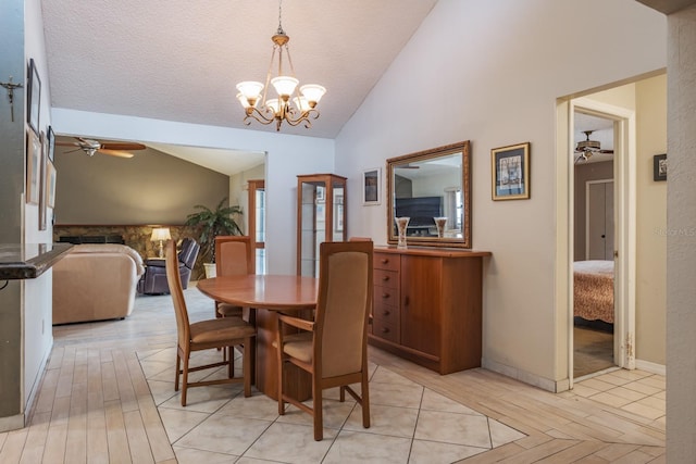2421 Eagle Chase Dr, Palm Harbor, FL 34683 - dining area featuring a ceiling fan, lofted ceiling, light wood finished floors, and a chandelier