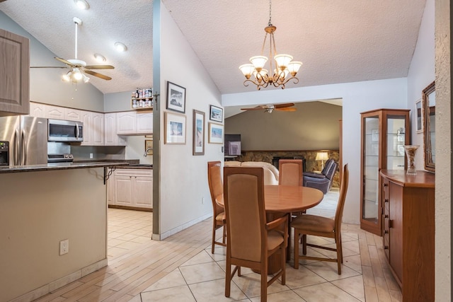 2421 Eagle Chase Dr, Palm Harbor, FL 34683 - dining area featuring a ceiling fan, vaulted ceiling, a textured ceiling, a chandelier, and light tile patterned floors