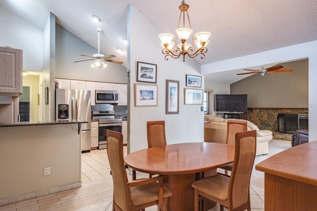2421 Eagle Chase Dr, Palm Harbor, FL 34683 - dining space with a ceiling fan, lofted ceiling, a textured ceiling, a chandelier, and light tile patterned floors
