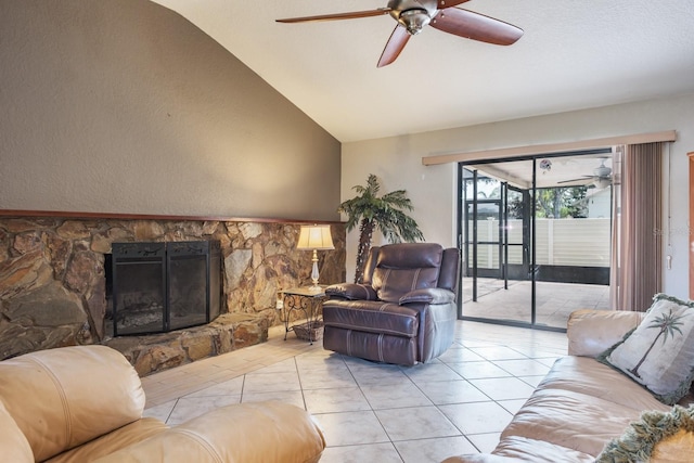 2421 Eagle Chase Dr, Palm Harbor, FL 34683 - living area featuring a ceiling fan, lofted ceiling, light tile patterned floors, and a stone fireplace
