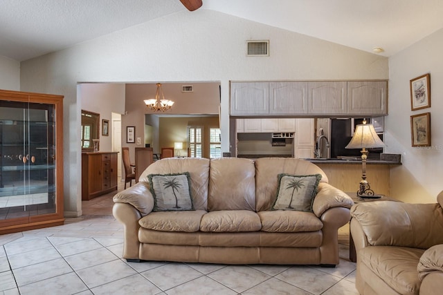 2421 Eagle Chase Dr, Palm Harbor, FL 34683 - living area with a chandelier, light tile patterned flooring, and high vaulted ceiling