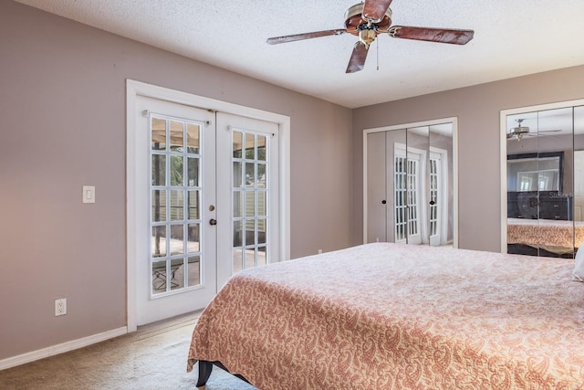 2421 Eagle Chase Dr, Palm Harbor, FL 34683 - bedroom featuring carpet floors, french doors, two closets, and a ceiling fan