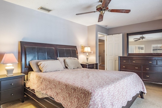 2421 Eagle Chase Dr, Palm Harbor, FL 34683 - bedroom featuring light carpet, ceiling fan, and a textured ceiling