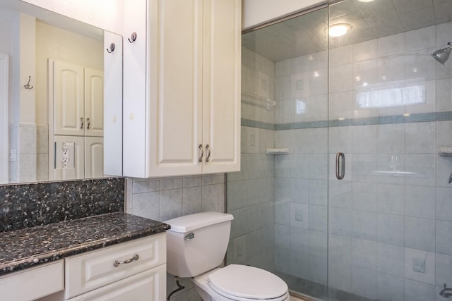 2421 Eagle Chase Dr, Palm Harbor, FL 34683 - bathroom featuring tile walls, vanity, a shower stall, and backsplash