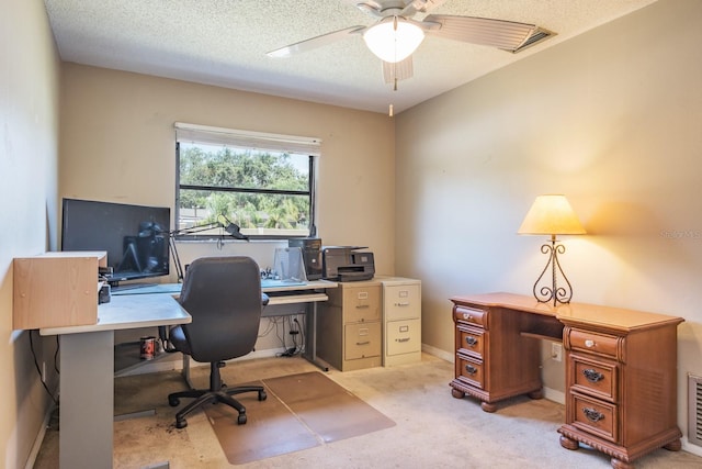 2421 Eagle Chase Dr, Palm Harbor, FL 34683 - home office with a ceiling fan, light carpet, and a textured ceiling