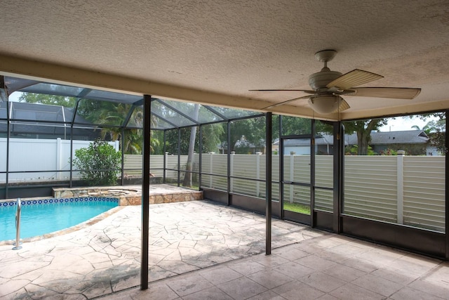 2421 Eagle Chase Dr, Palm Harbor, FL 34683 - view of swimming pool with an in-ground hot tub, a patio, a lanai, a fenced backyard, and a ceiling fan