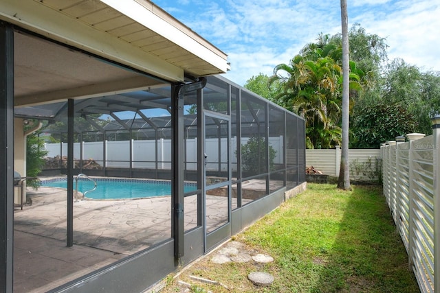2421 Eagle Chase Dr, Palm Harbor, FL 34683 - view of swimming pool with a fenced backyard, a patio, and glass enclosure
