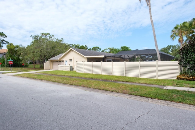 2421 Eagle Chase Dr, Palm Harbor, FL 34683 - view of property exterior featuring driveway, stucco siding, and a garage