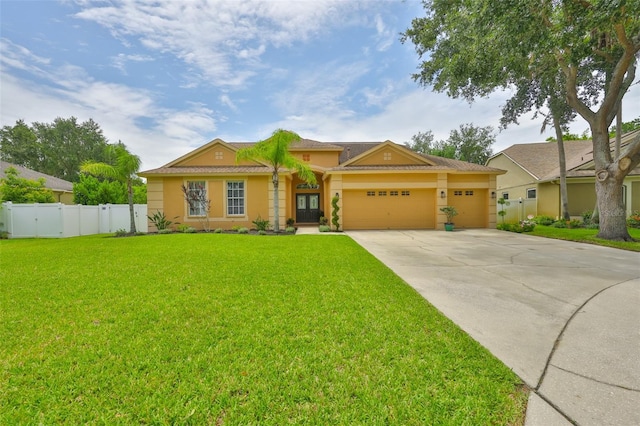 12305 Freesia Ct, Riverview, FL 33569 - view of front of home with an attached garage, concrete driveway, and stucco siding